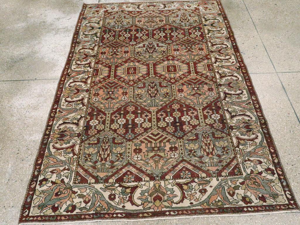 A vintage Persian Bakhtiari accent rug handmade during the mid-20th century.

Measures: 4' 7