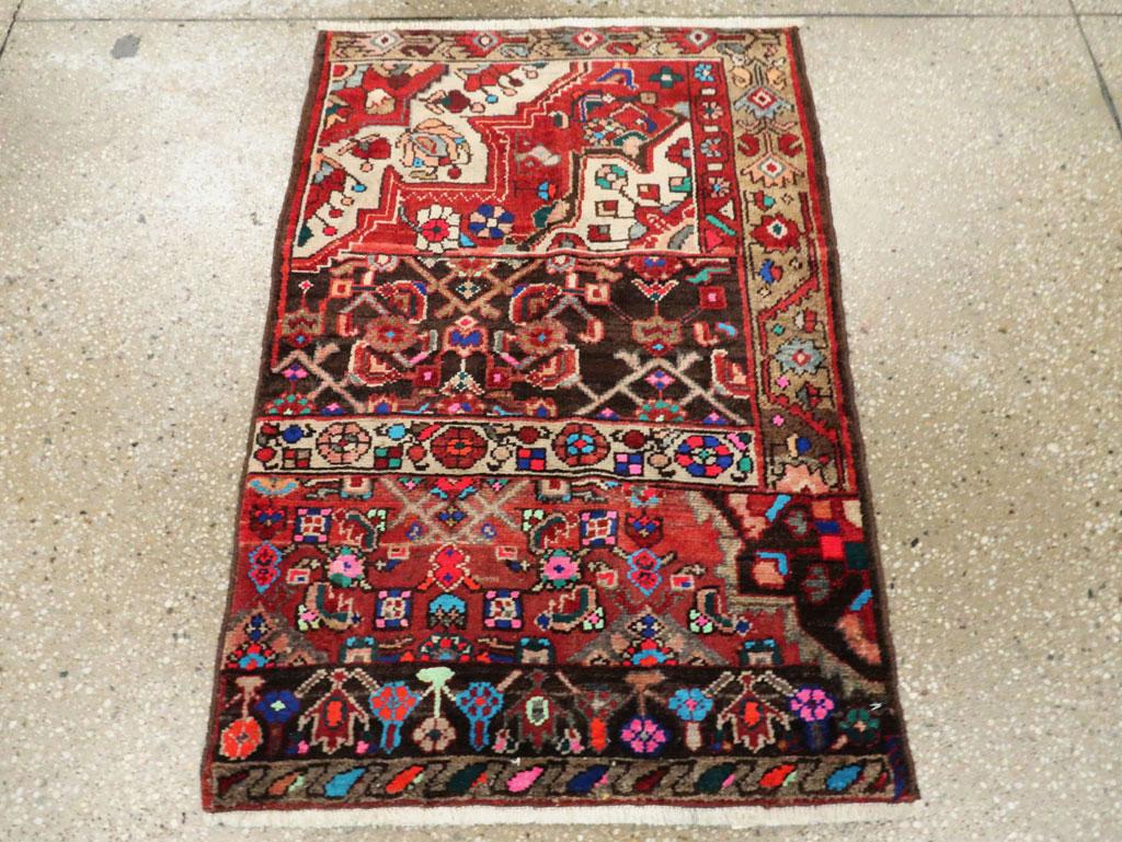 A vintage Persian Wagireh (sampler rug) Hamadan throw rug handmade during the mid-20th century with bright cotton highlights.

Measures: 2' 1