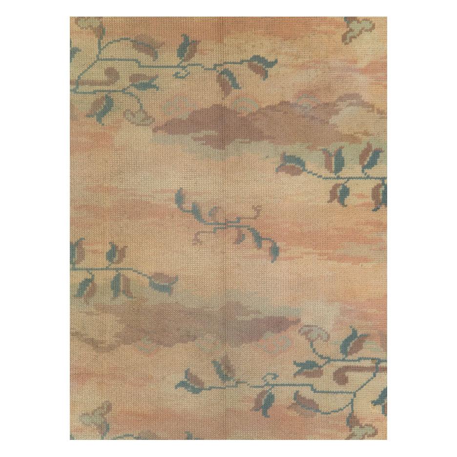 A vintage Polish Art Nouveau accent rug handmade during the mid-20th century. Creamy pastel tones create the cloud-like motif contrasted by the darker leafy vine pattern and geometric border.

Measures: 5' 6