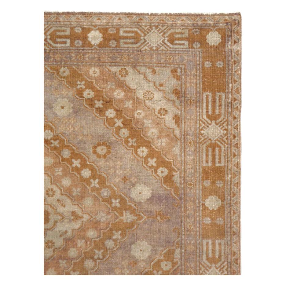 A vintage Samarkand accent rug handmade during the mid-20th century.

Measures: 5' 4