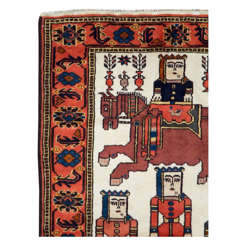 A vintage Persian pictorial tribal folk accent rug handmade by the Kurdish tribes of northwest Persia during the mid-20th century.

Measures: 3' 9