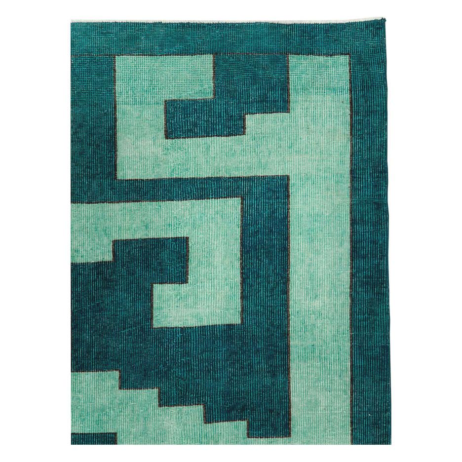 A vintage Turkish Anatolian rug handmade during the mid-20th century with a geometric stepped design in teal.

Measures: 3' 1
