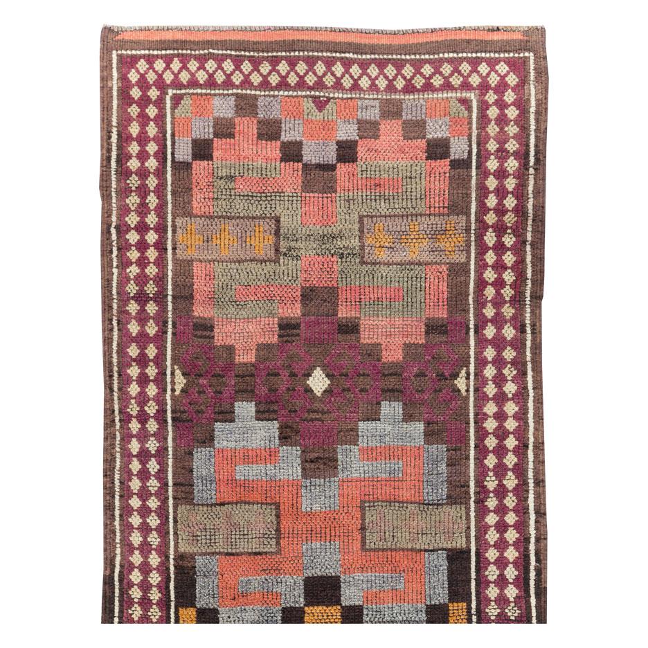 A vintage Turkish Anatolian long runner handmade during the mid-20th century.

Measures: 2' 11
