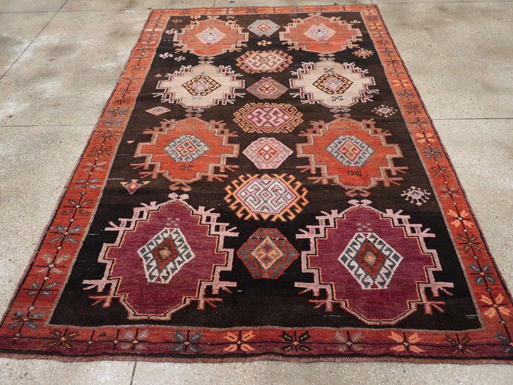 A vintage Turkish Anatolian small room size tribal style carpet handmade during the mid-20th century.

Measures: 6' 9