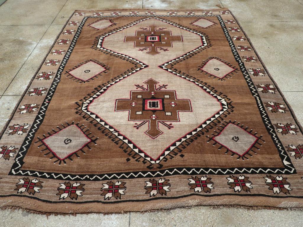 A vintage Turkish Anatolian tribal room size carpet handmade during the mid-20th century.

Measures: 9' 0