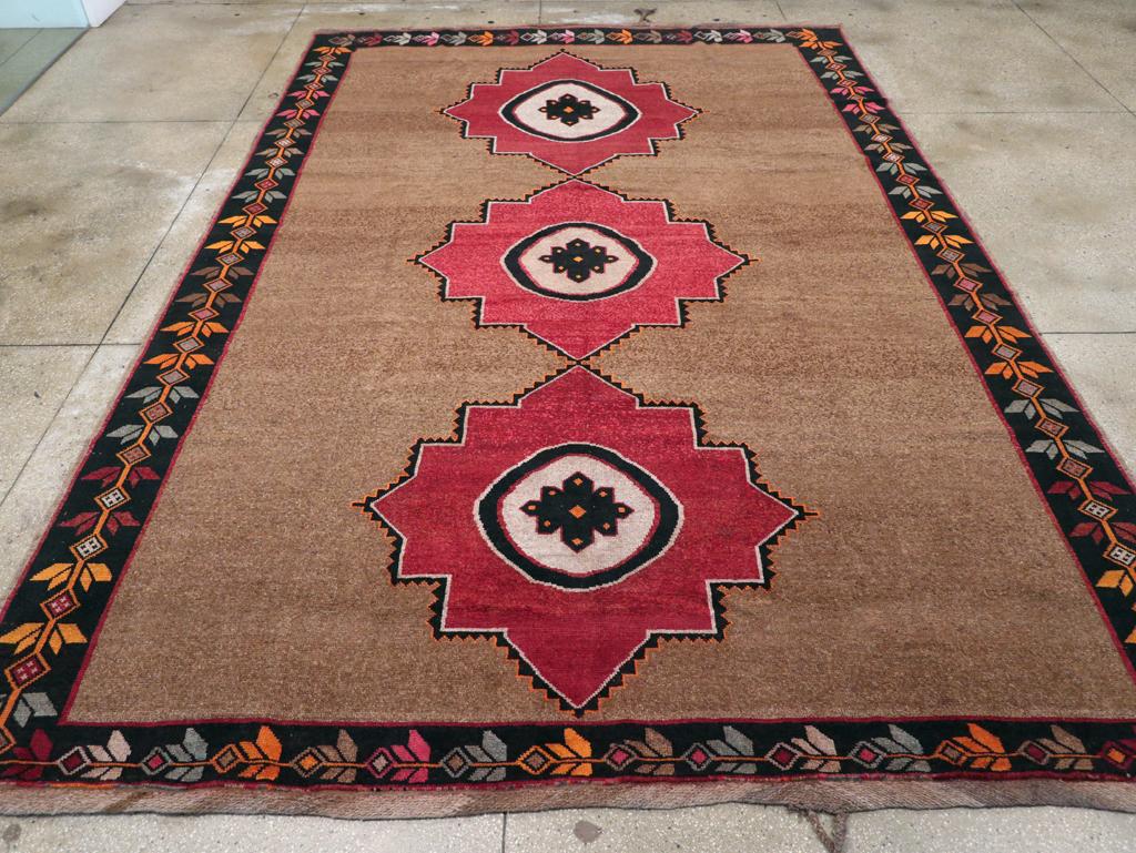 A vintage Turkish Anatolian tribal room size carpet handmade during the mid-20th century.

Measures: 10' 0