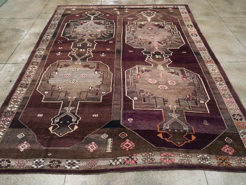 A vintage Turkish Anatolian tribal room size carpet handmade during the mid-20th century.

Measures: 11' 0
