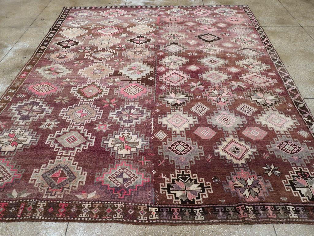 A vintage Turkish Anatolian tribal room size carpet handmade during the mid-20th century.

Measures: 10' 11