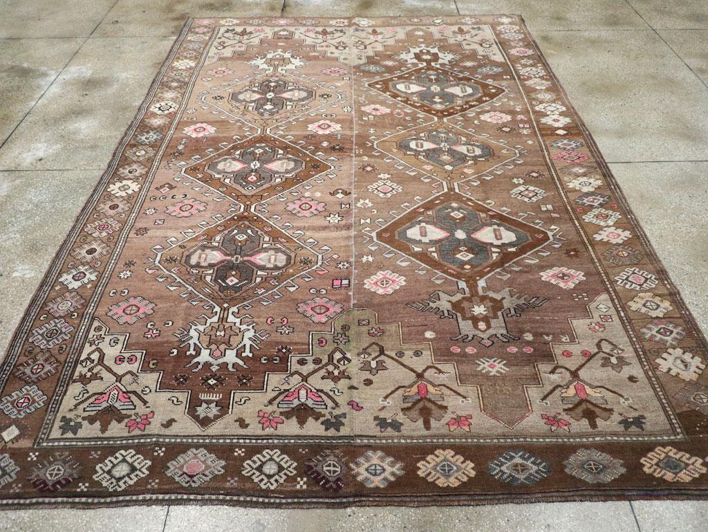 A vintage Turkish Anatolian tribal room size carpet handmade during the mid-20th century.

Measures: 8' 11