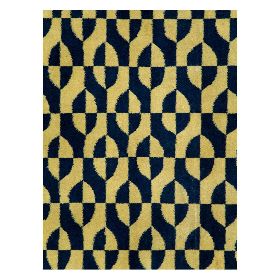A vintage Turkish Art Deco accent rug handmade during the mid-20th century with a contemporary pattern in yellow and dark blue.

Measures: 6' 7