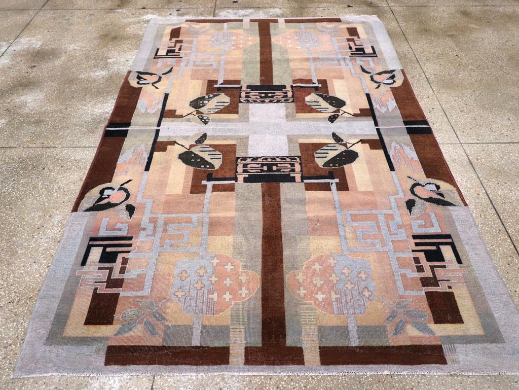 A vintage Turkish accent rug handmade during the mid-20th century. This carpet is a more Contemporary / Art Deco style rendition of the traditional aerial view design of Persian and Indo-Persian Chahar Bagh (Four Gardens). One of the most famous