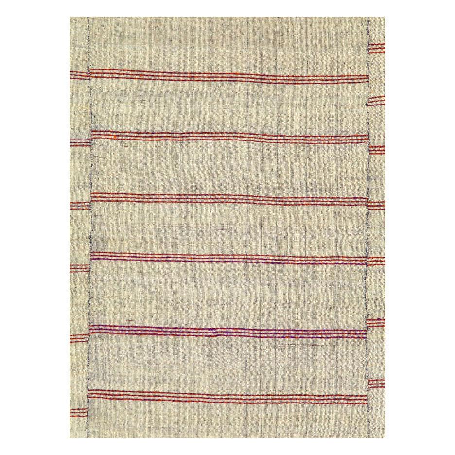 A vintage Turkish flat-weave Kilim accent rug handmade during the mid-20th century.

Measures: 6' 8