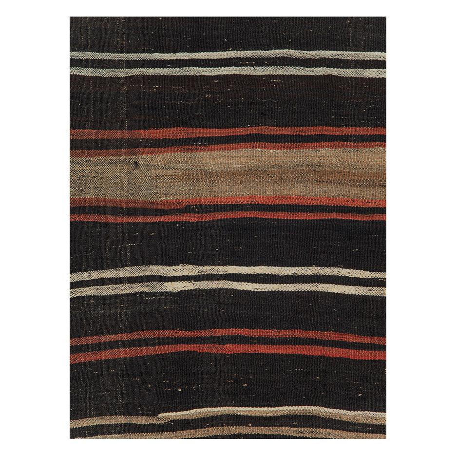 A vintage Turkish flatweave Kilim accent rug handmade during the mid-20th century.

Measures: 5' 5