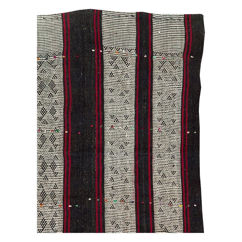 A vintage Turkish flatweave Kilim accent rug handmade during the mid-20th century.

Measures: 6' 1