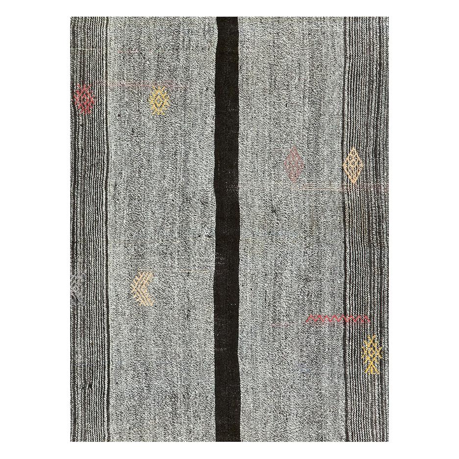 A vintage Turkish flatweave Kilim accent rug handmade during the mid-20th century.

Measures: 6' 8