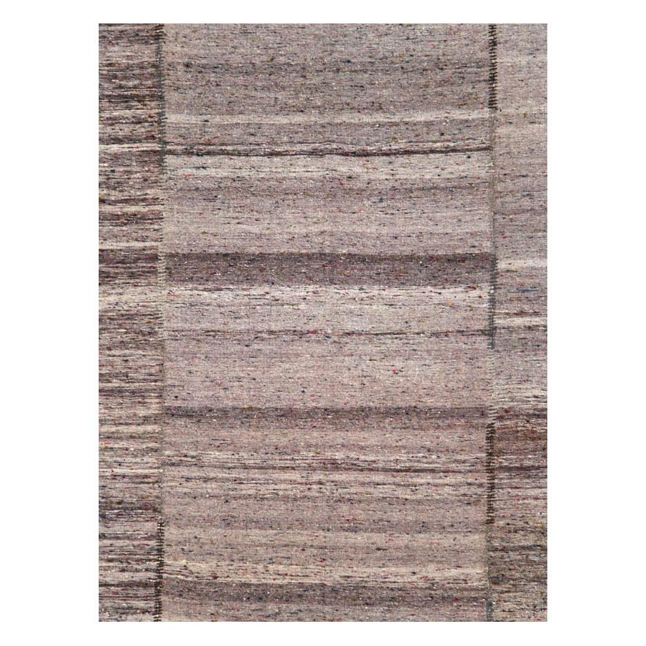 A vintage Turkish flat-weave Kilim rustic accent rug handmade during the mid-20th century in shades of purple and pewter with hints of brown and charcoal, and colorful speckles throughout.

Measures: 6' 2