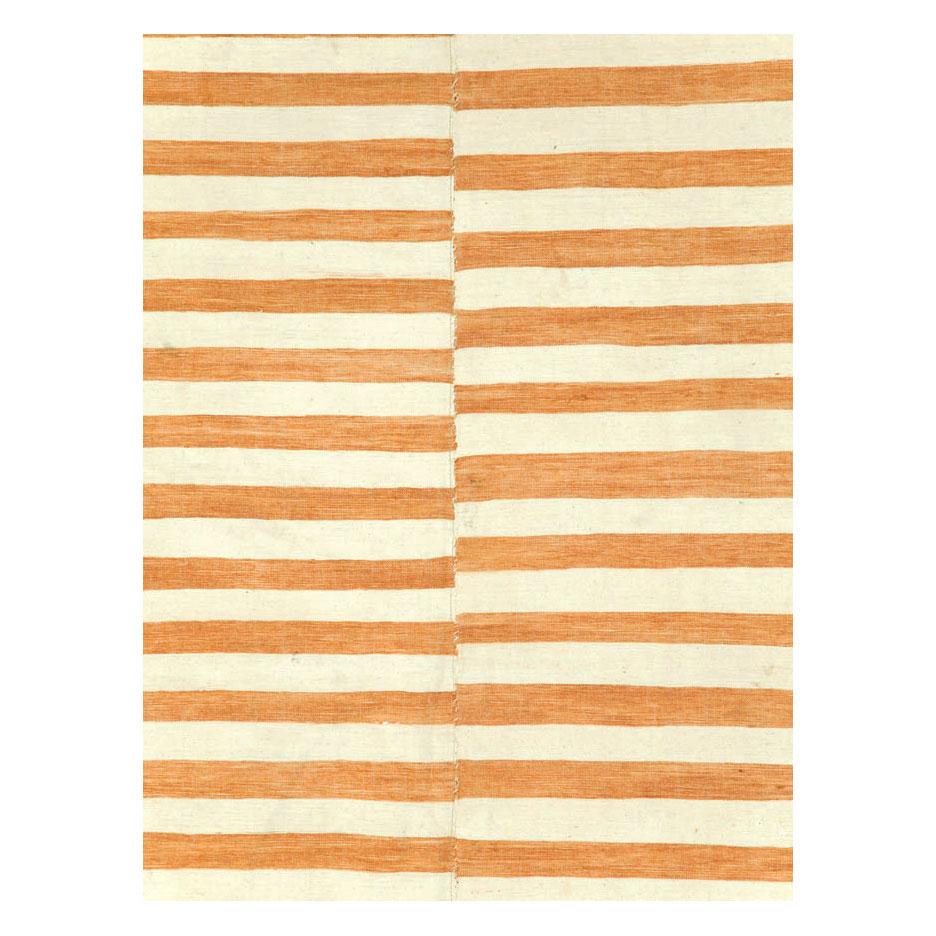 A vintage Turkish flat-weave Kilim accent rug handmade during the mid-20th century with 4 columns of offset stripes in cream and sienna.

Measures: 6' 6