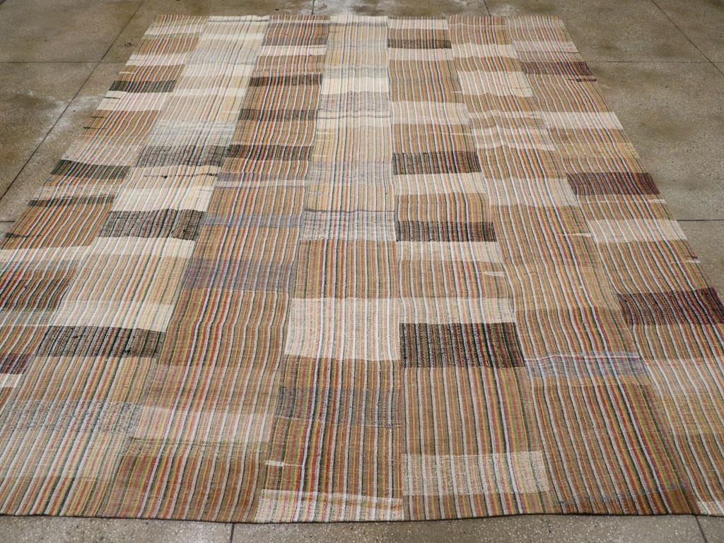 A vintage Turkish flatweave Kilim room size carpet handmade during the mid-20th century.

Measures: 10' 7