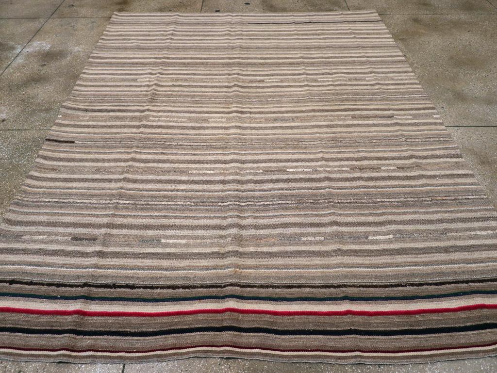A vintage Turkish flatweave Kilim room size carpet handmade during the mid-20th century.

Measures: 8' 3