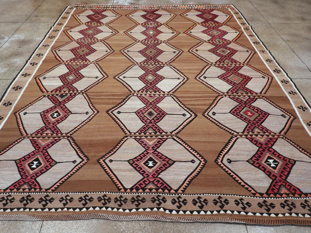 A vintage Turkish tribal flatweave Kilim room size carpet handmade during the mid-20th century.

Measures: 11' 4