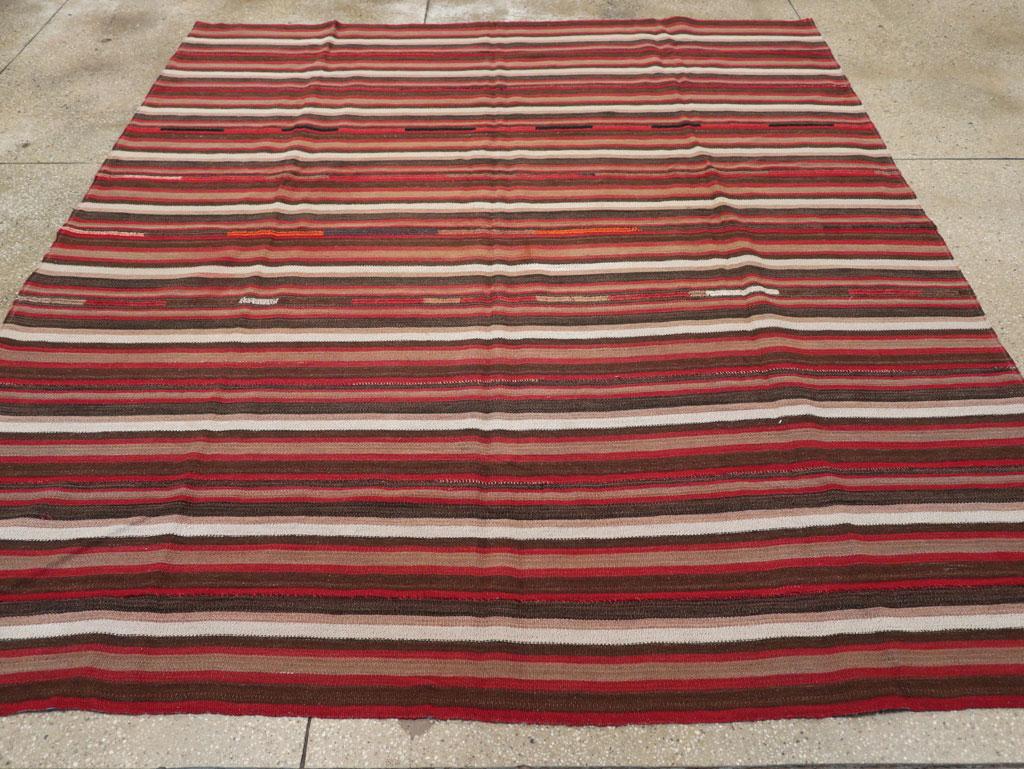 A vintage Turkish flatweave Kilim small room size carpet in square format handmade during the mid-20th century.

Measures: 7' 8
