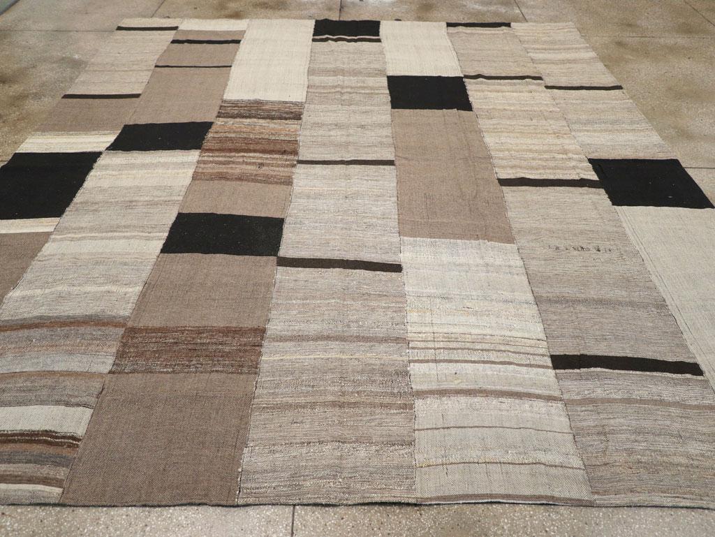 A modern Turkish flatwoven Kilim square room size carpet handmade during the 21st century.

Measures: 11' 2