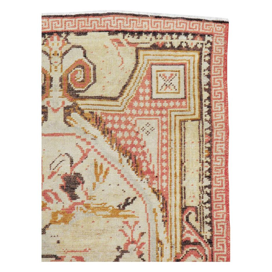 A vintage Turkish Ghiordes throw rug handmade during the mid-20th century.

Measures: 3' 7