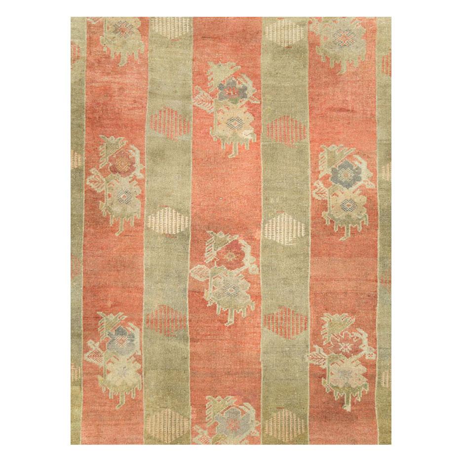 A vintage Turkish Oushak square room size carpet handmade during the mid-20th century with a large-scale light green cane design of 6 poles over a coral field.

Measures: 10' 6