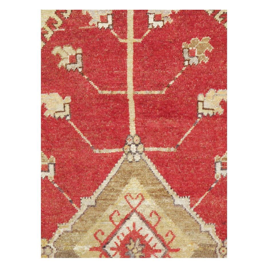 A vintage Turkish Oushak accent rug handmade during the mid-20th century.

Measures: 5' 5