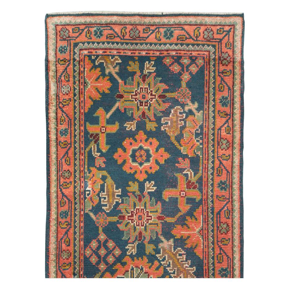A vintage Turkish Oushak rug in runner format handmade during the mid-20th century.

Measures: 3' 0