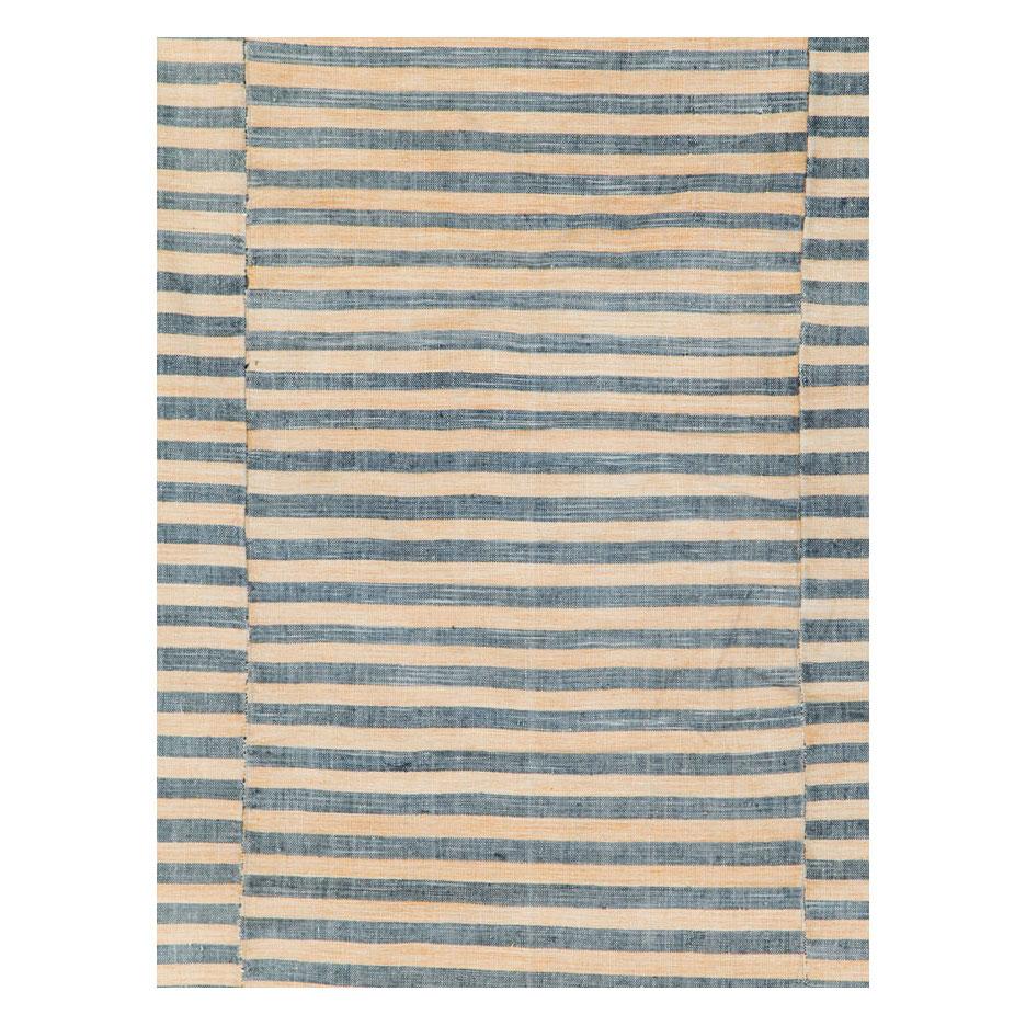 A vintage Turkish flat-weave Kilim accent rug handmade during the mid-20th century with 3 striped columns in straw and slate grey.

Measures: 5' 11