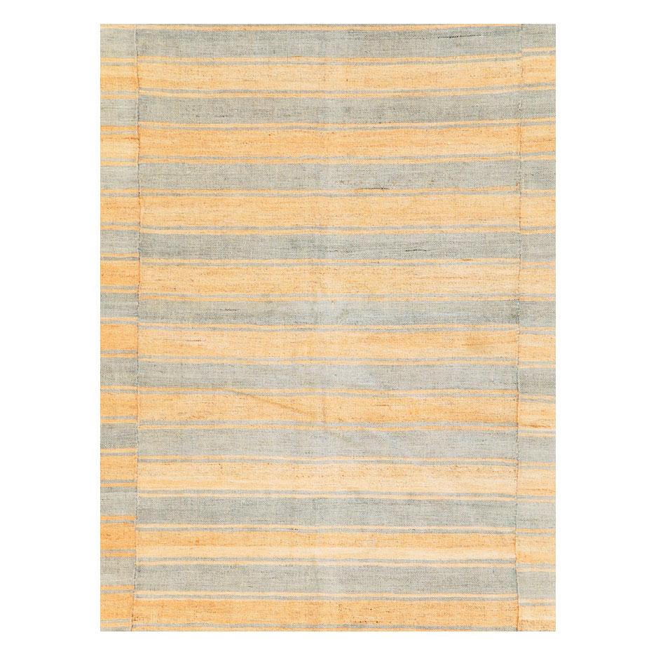 A vintage Turkish flat-weave Kilim accent rug handmade during the mid-20th century with a striped design offset on 3 stitched panels.

Measures: 6' 1