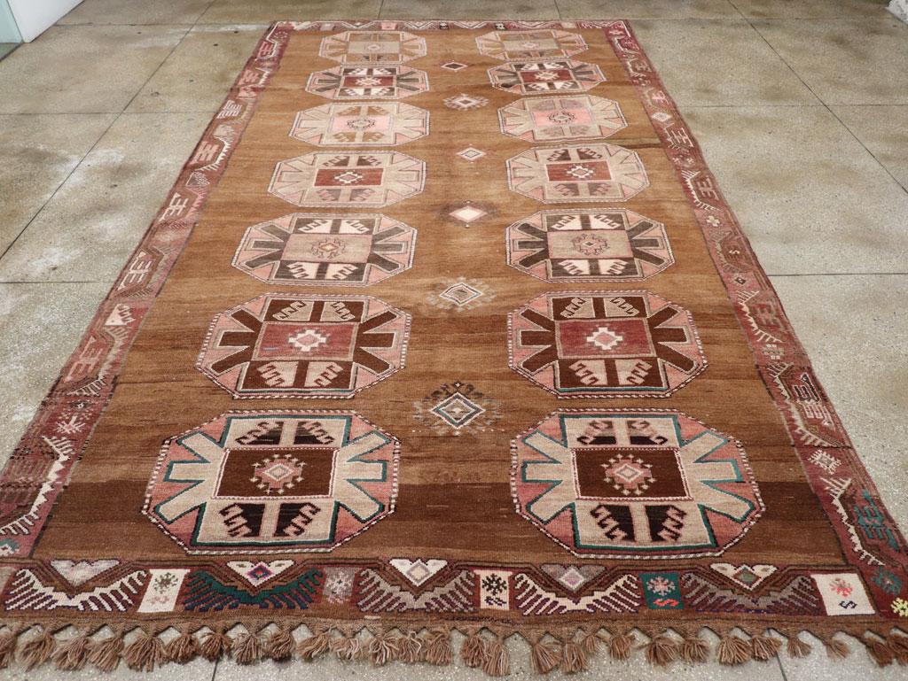 A vintage Turkish Anatolian long tribal room size carpet handmade during the Mid-20th century.

Measures: 9' 2
