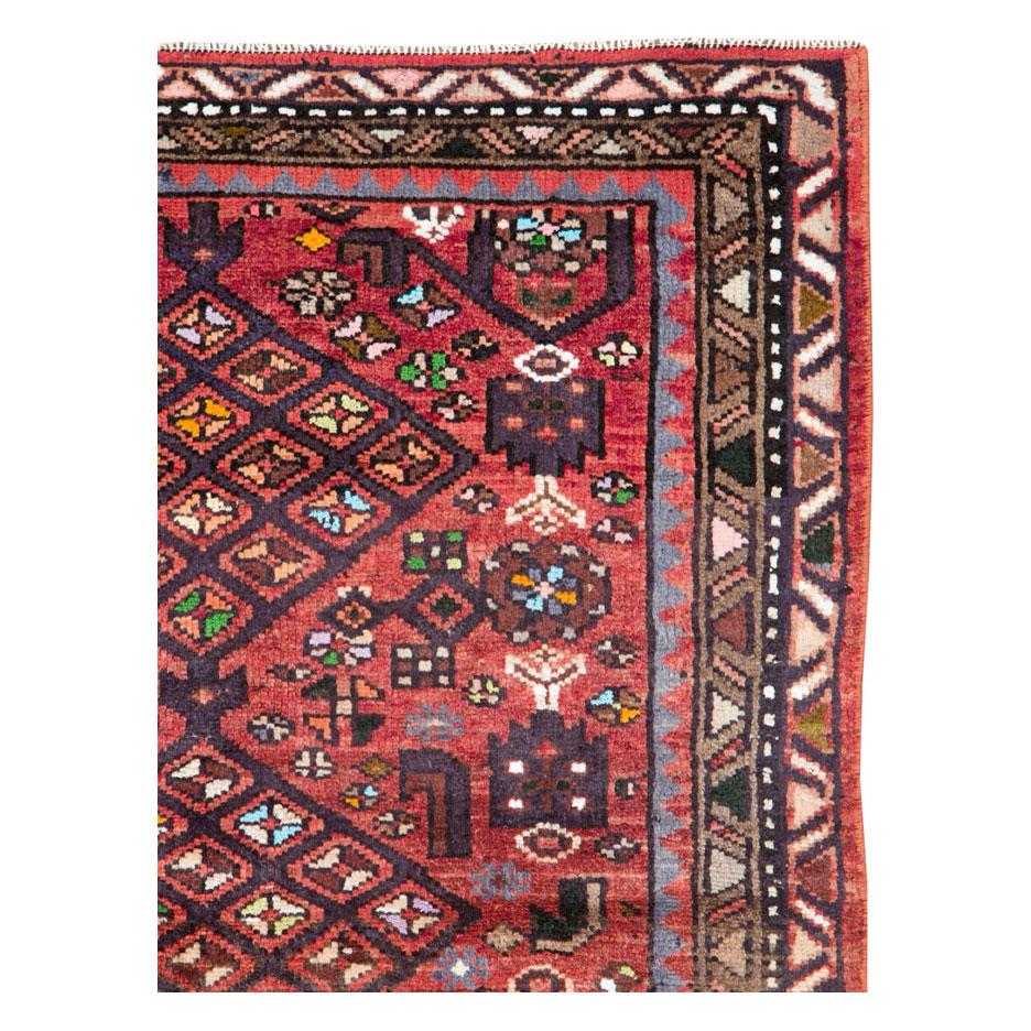 A vintage Persian Hamadan throw rug handmade during the mid-20th century.

Measures: 3' 7
