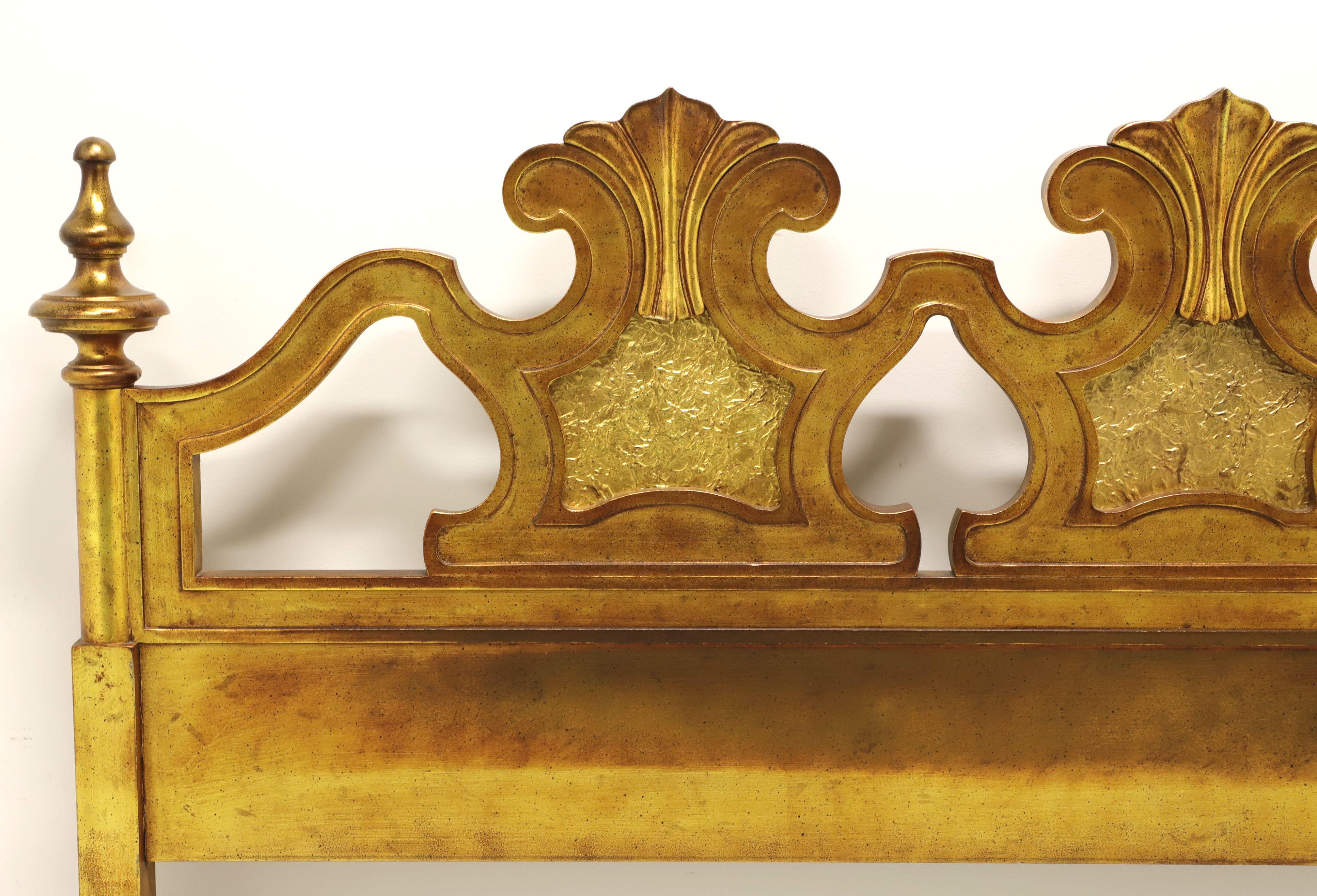 A Spanish style king size headboard by Drexel, from their Velero Collection. Solid hardwood with antiqued gold finish with some lighter and darker tones of gold. Features three decorative carvings with a crinkled foil effect to center of each and