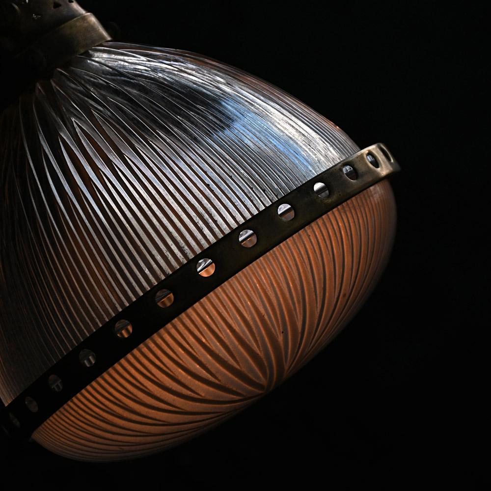 Mid-20th Century Holophane Pendant Light 
Dimensions in inches: H 13” x W 10.5” x D 10.5” 
Age: Mid-20th century 
Origin: France
Condition: Good
Overview
A good example of a mid-20th century French glass Holophane light with brass cage. This is