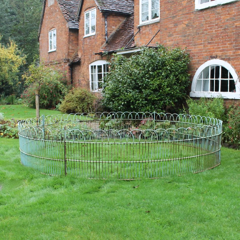 A large, at eleven foot in diameter, mid-20th century, hooped iron raised bed or pond surround. In excellent condition and retaining its original paint.

English, circa 1950.