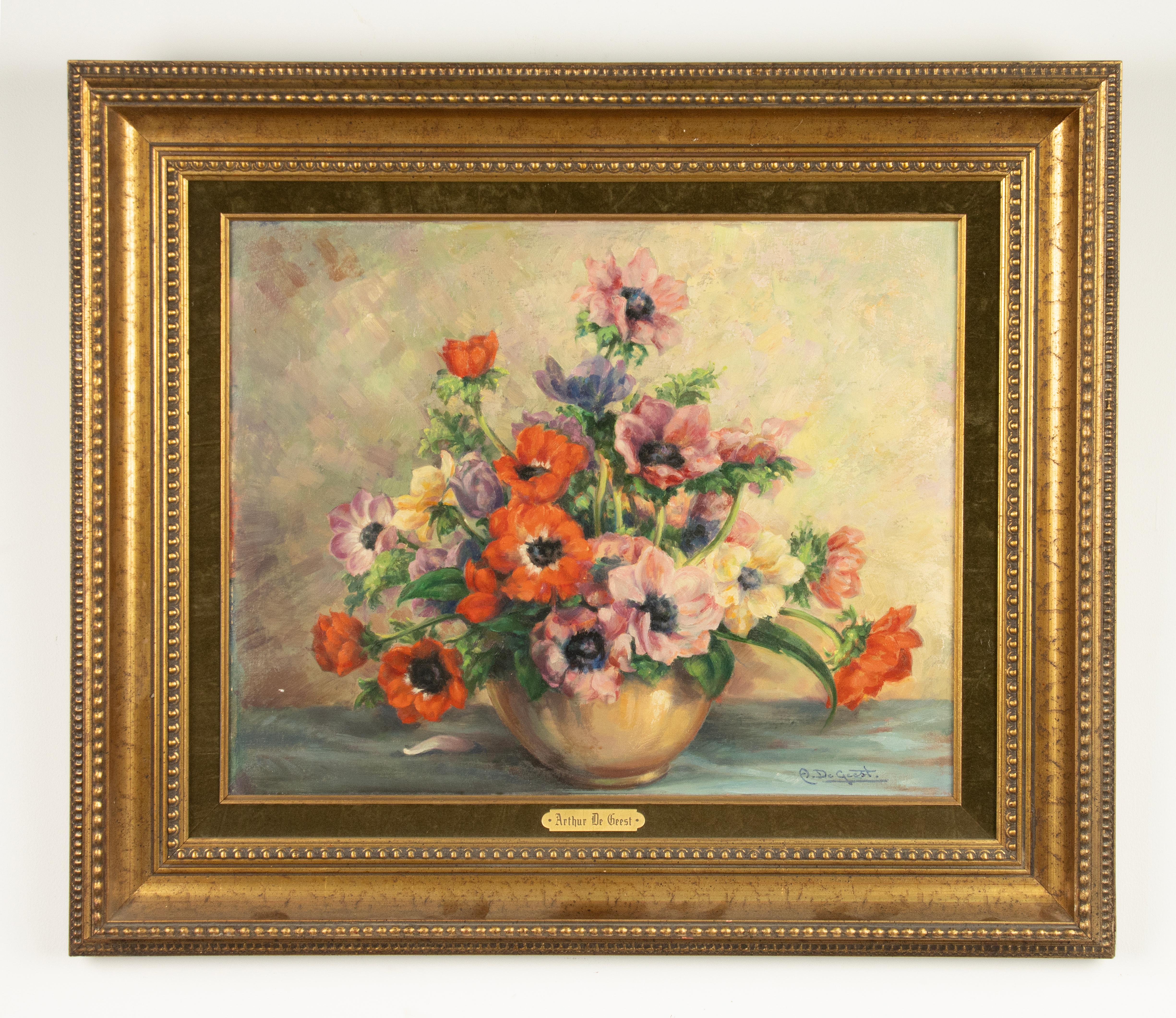 A colorful flower still life in impressionistic style. Oil paint on canvas, in a gilt frame. Signed right under: Arthur de Geest. 

Arthur de Geest. Belgium, 1894-1968
Painted mainly figures and landscapes. Designed panels inspired by work on the