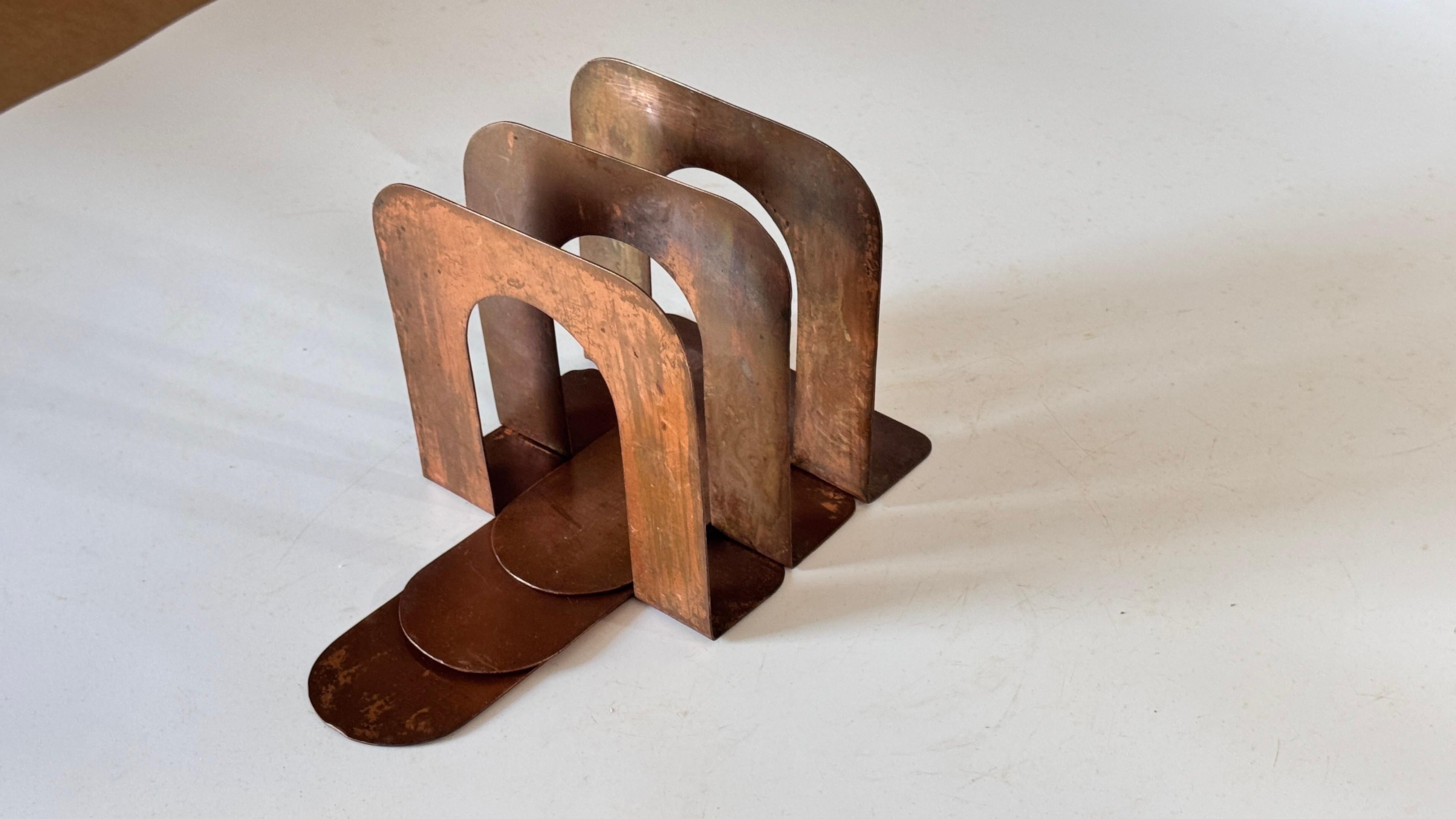 Mid-20th Century Industrial Metal Letter Holder, Rust Patina, Modular Arcade Design

Description:
This mid-20th century industrial letter holder is a striking example of minimalist and functional design, crafted entirely from rust-patinated metal.