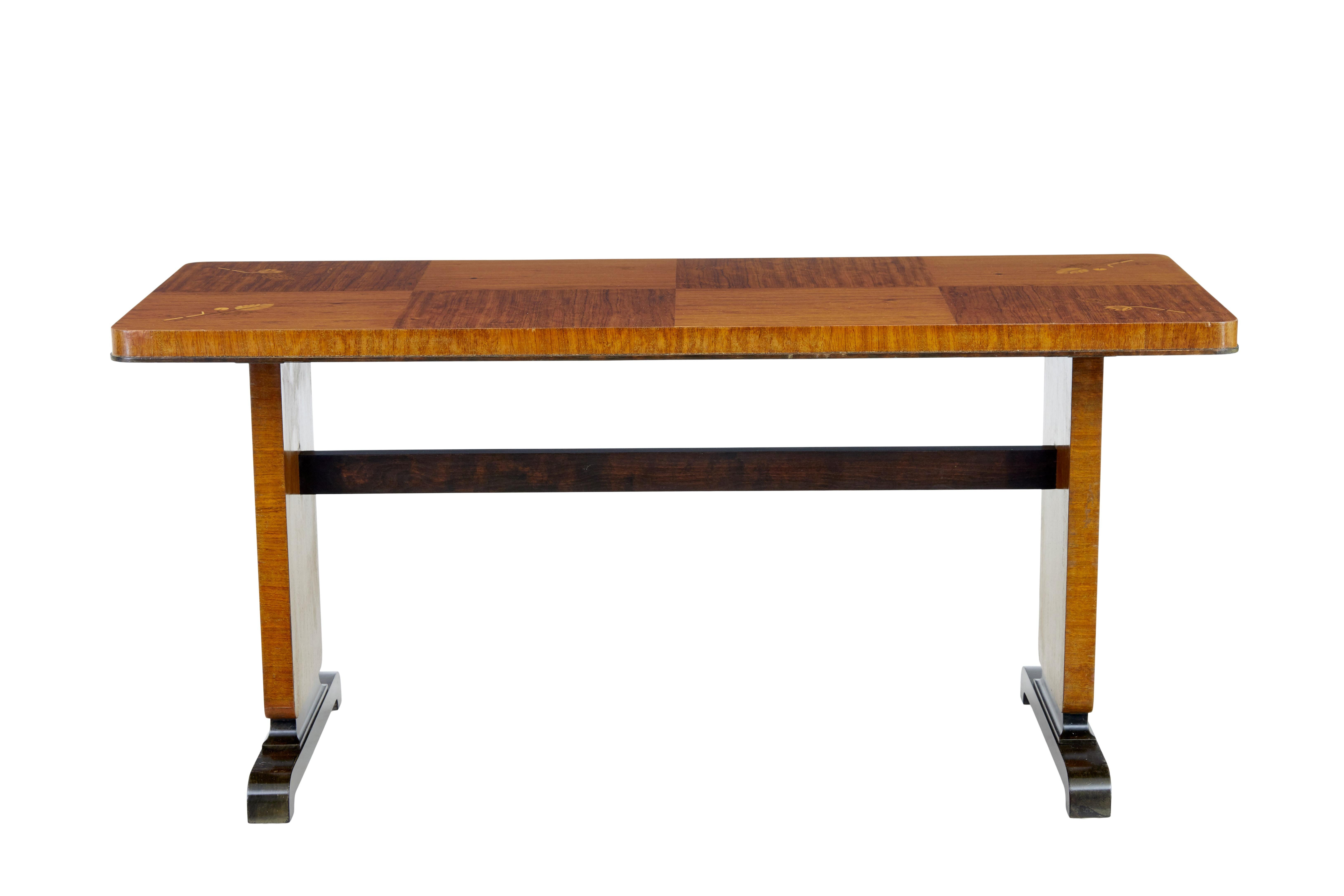 Mid 20th century inlaid birch coffee table circa 1950.

Coffee / occasional table.  A little bit of an unusual height makes this more suited to a sofa / side table.

Rectangular top with rounded edges, made from 8 arranged squares of veneer, 4 of