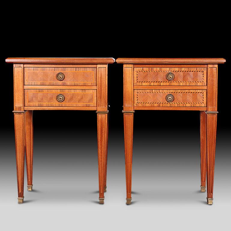 Pair of early-20th century Italian nightstands with book-matched and banded tops and further inlay and stringing to the drawer fronts and cases. Each fitted with a pair of drawers. Smart brass accent trim and brass capped feet to the square tapering