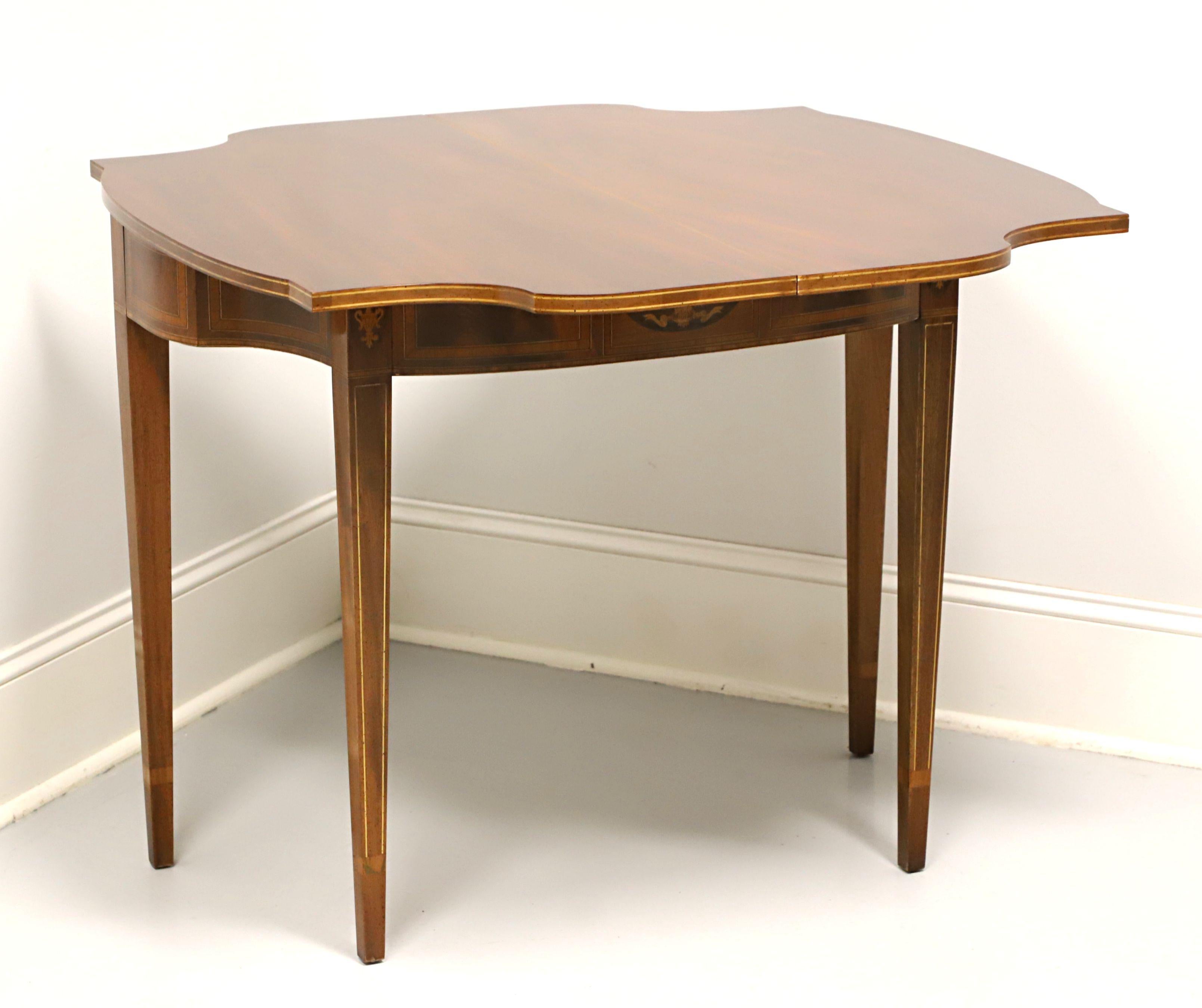 A Federal style game /console table, unbranded. Genuine mahogany with inlaid details, swivel fold top and straight tapered legs. Features the rotating fold top to create game table over an interior storage area for game pieces, a decorative inlaid