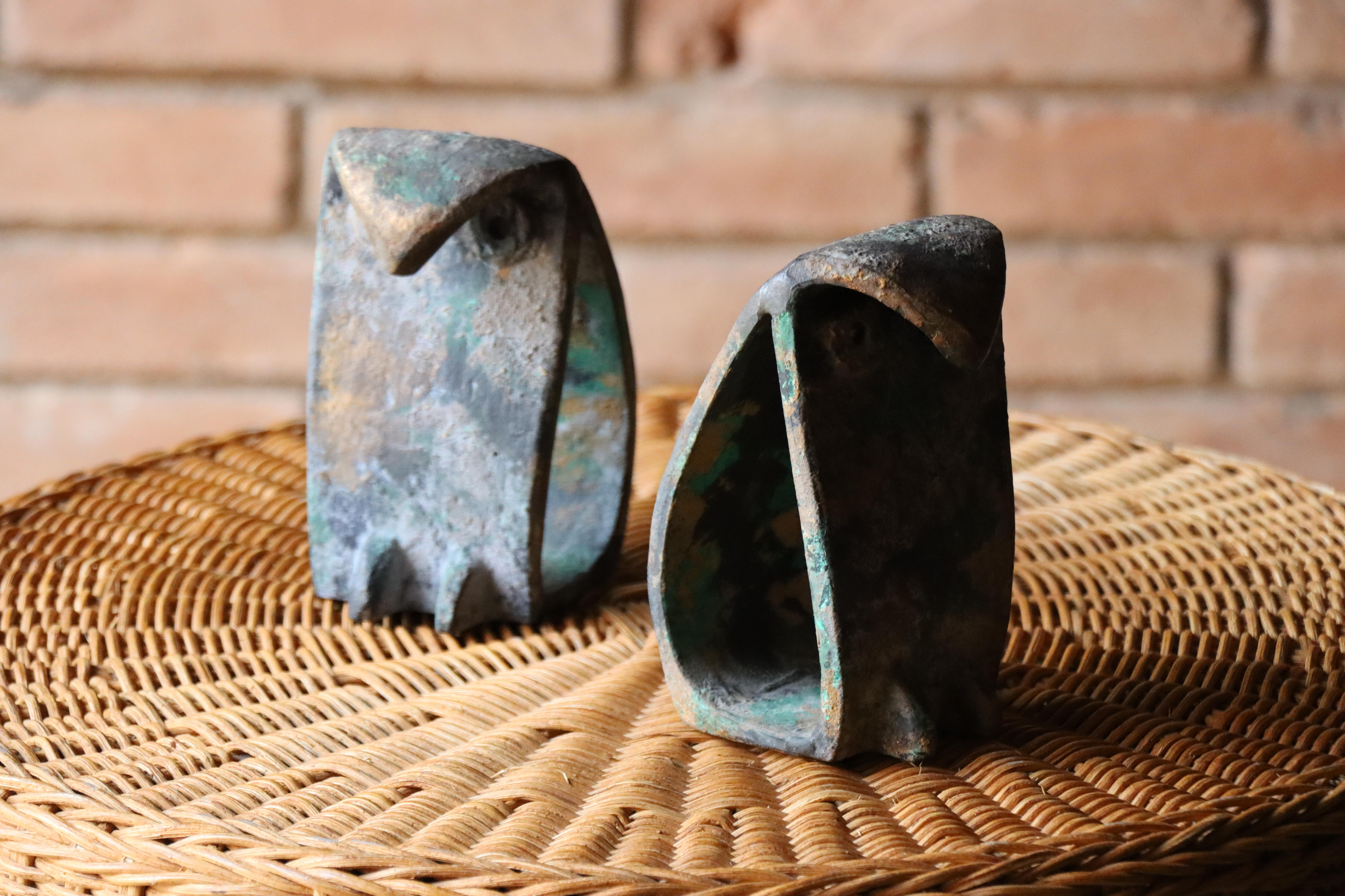 A handsome pair of Japanese iron bookends in the manner of Isamu Noguchi. These modernist owls have an applied patina that mimics age and provides a brutalist aesthetic. Collectible pieces perfect for display in any mid century modern bookcase.