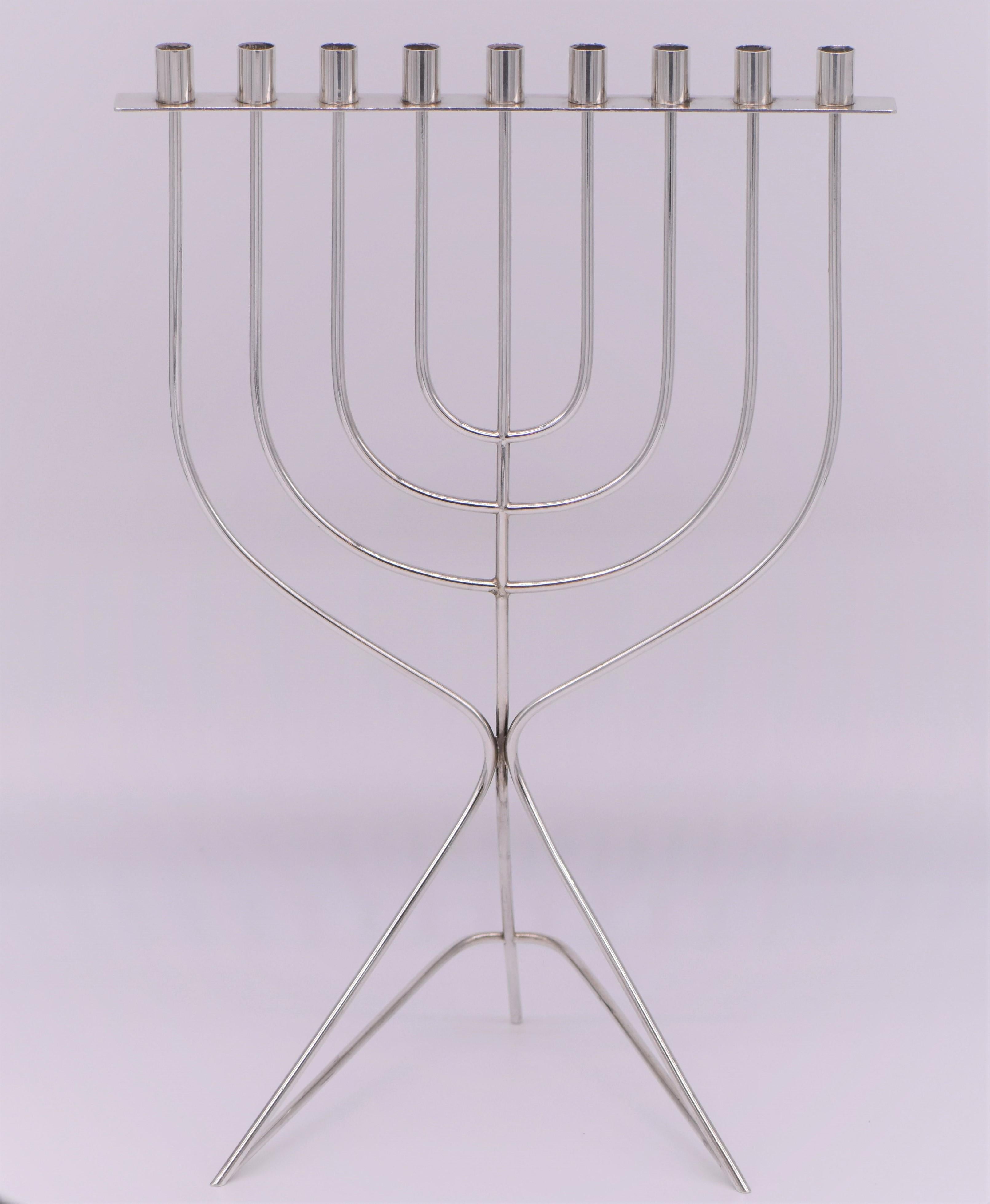 Hanukkah lamp created by David Heinz Gumbel, Israel, circa 1960.
Sterling silver, bent. Signed: 