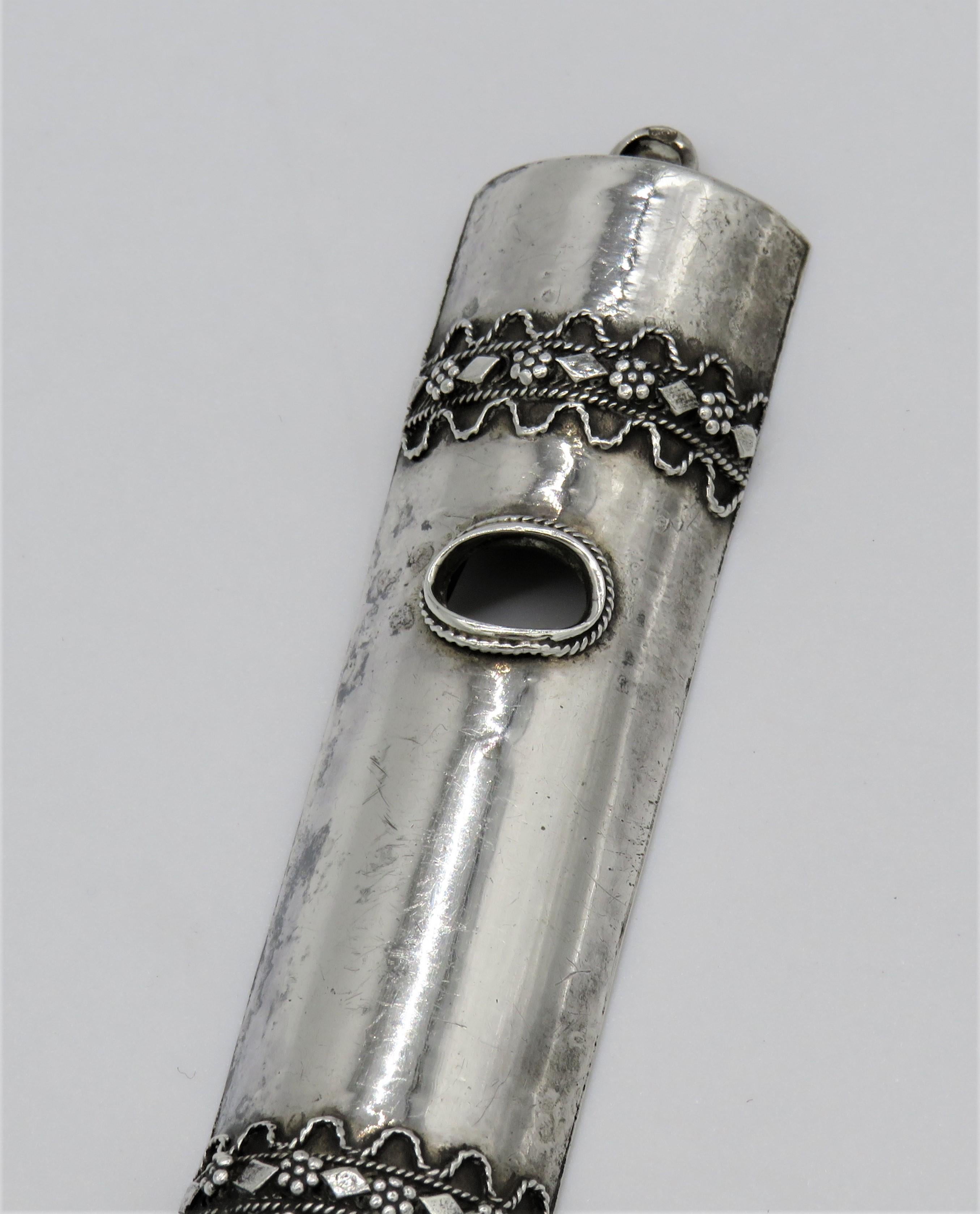 Fine silver and silver filigree Mezuzah, Israel, circa 1950.
The upper section decorated with a silver filigree, and with window that allow to see the parchment inside, the bottom section decorated with the same design as the upper section.
Marked