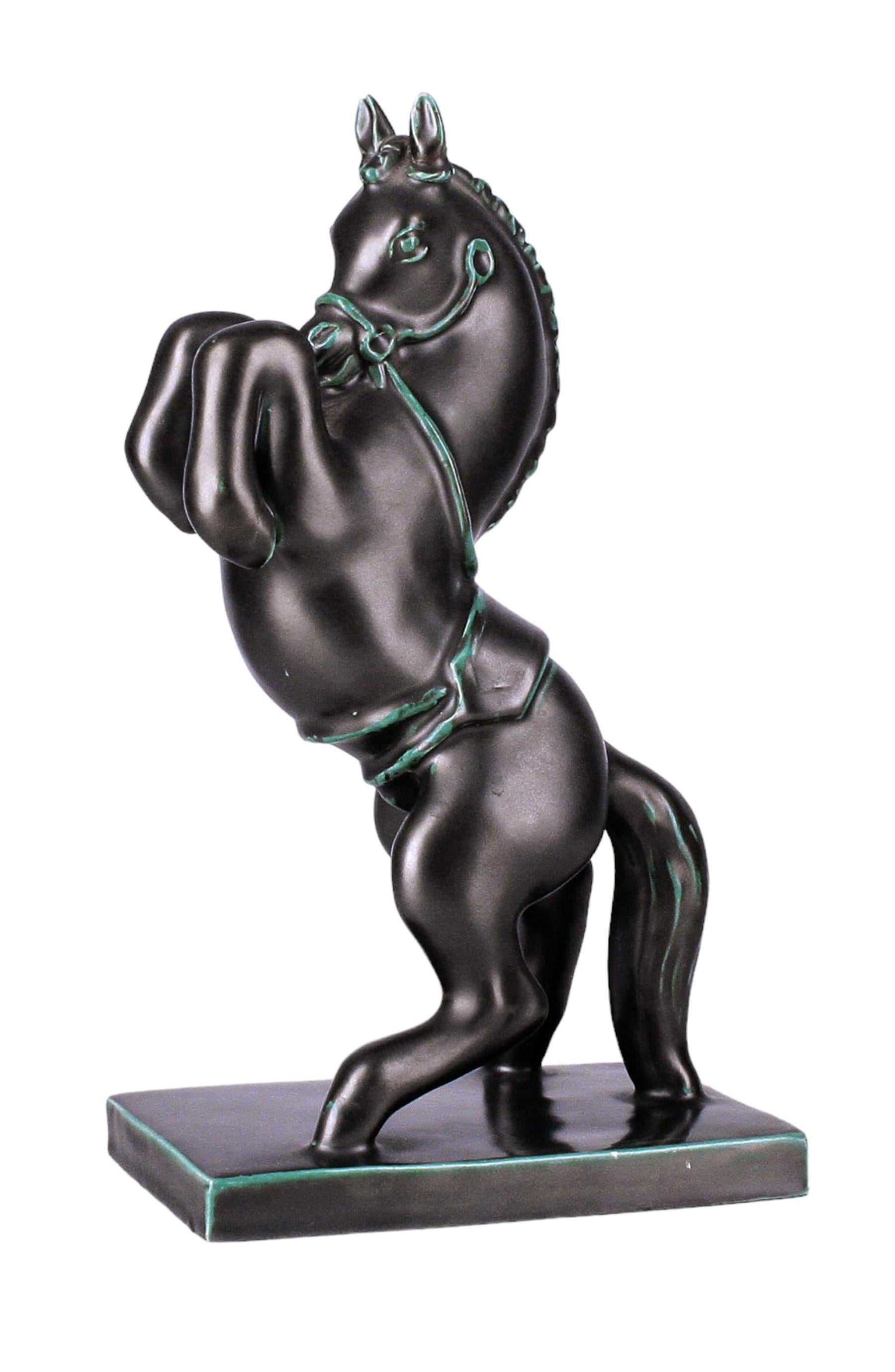 Mid-20th century Modern italian glazed black ceramic rearing horse sculpture by Ugo Zaccagnini & Figli

By: Ugo Zaccagnini & Figli
Material: ceramic, paint
Technique: pressed, molded, painted, hand-painted, hand-crafted, glazed
Dimensions: 4.5 in x