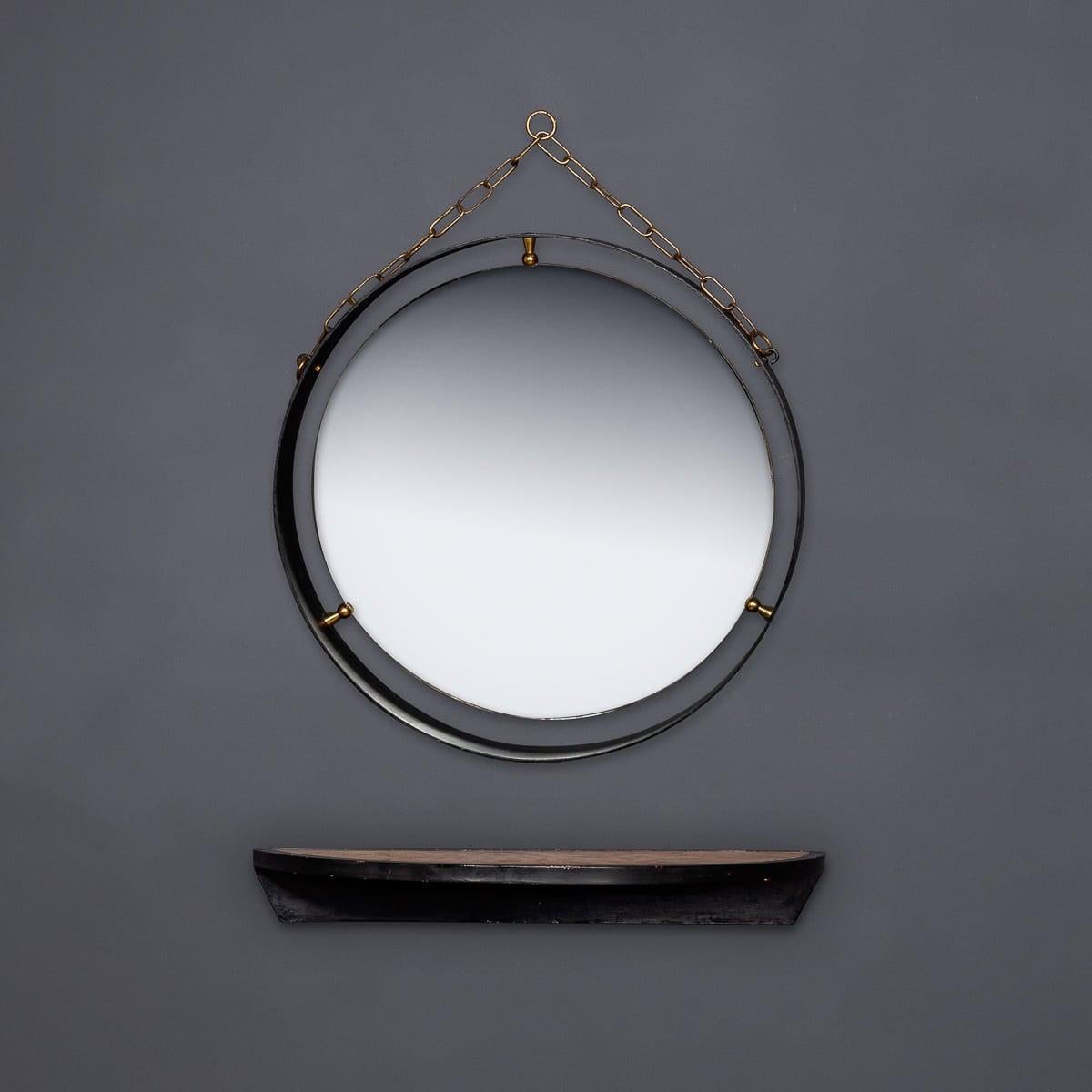 Miroir mural circulaire du milieu du 20e siècle avec un cadre en fer et des détails en laiton, complété par une console semi-circulaire assortie avec un insert en marbre italien. Une paire étonnante qui ajoutera de l'élégance et du style à n'importe