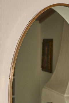 Mid 20th century Italian brass edged oval wall mirror