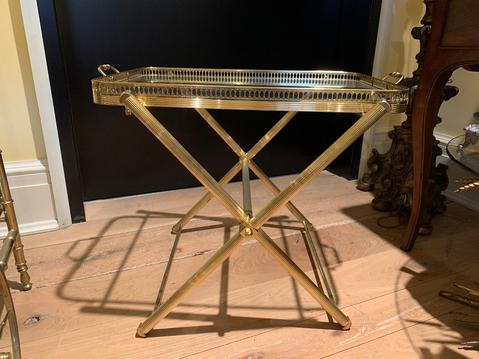 Mid-20th century Italian brass and glass tray on folding stand as side table.