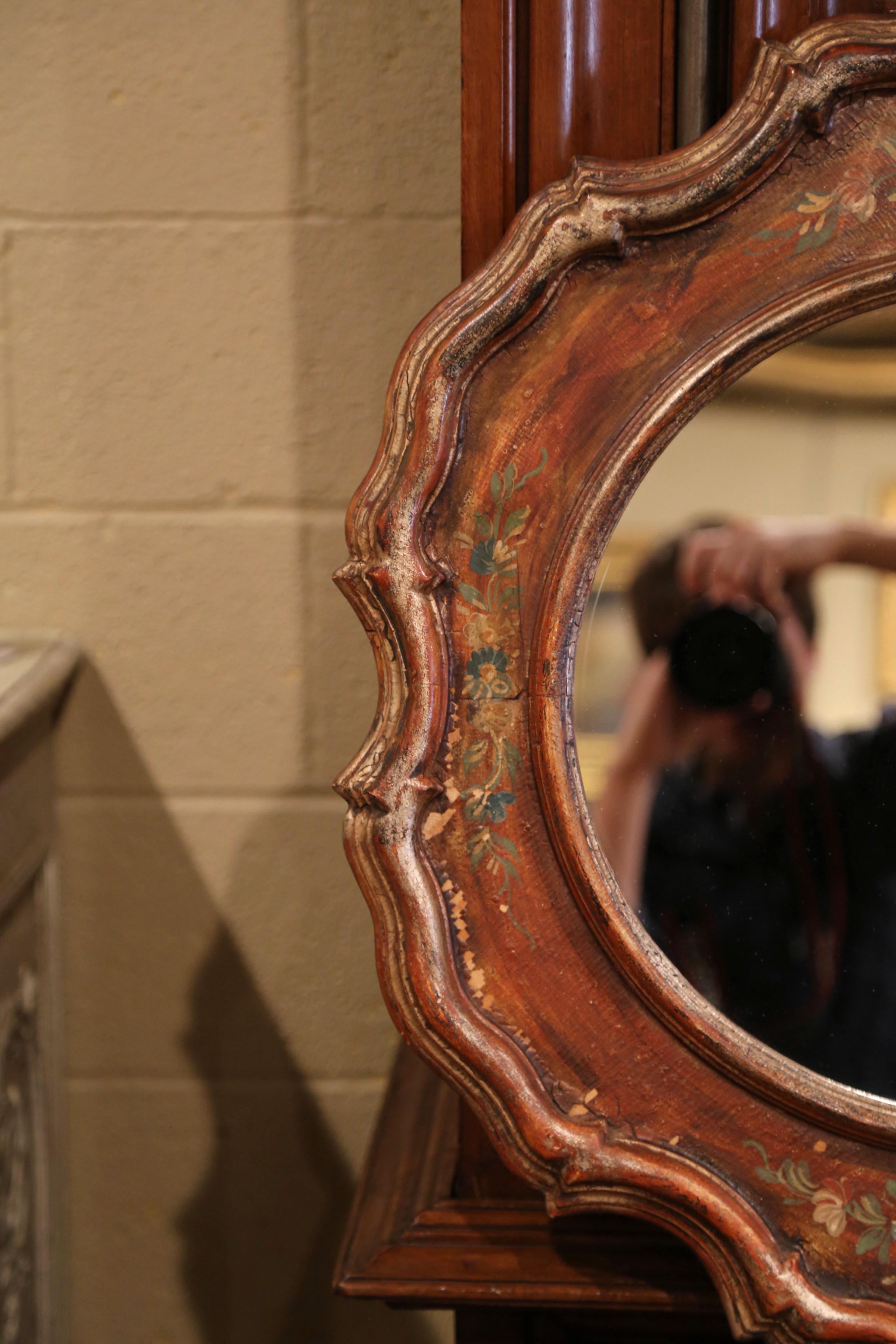 Decorate a powder room or a girl's bedroom with this elegant antique mirror. Crafted in Italy circa 1960 and round in shape, the colorful carved mirror features a thick scrolled molding around the frame with a circular glass in the center, the frame